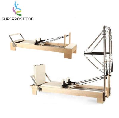 China Commercial fitness center training exercise half pulley tower pilates yoga machine trapeze reformer for sale