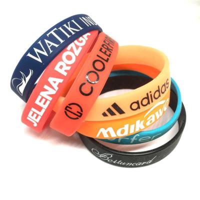 China New custom debossed eco-friendly custom silicone wrist bands logo rubber wristbands for sale