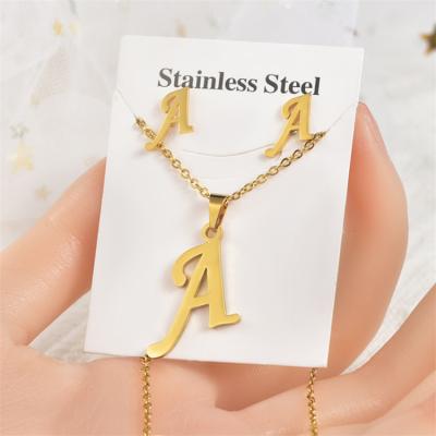 China Fashion CLASSIC Jewelry Set Stainless Steel Necklace Letter Earrings Personality English Letter Electroplating Pendant Necklace for sale