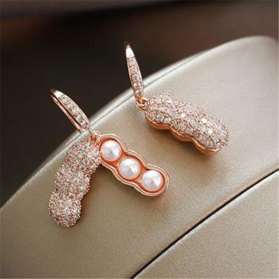 China New cute shiny diamond pea earrings personality temperament peanut pearl earrings plated alloy ladies earrings for sale