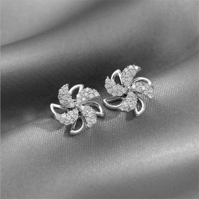 China 2021 New CLASSIC Electroplating Alloy Diamond-studded Rotating Windmill Earrings Ladies Small 925 Silver Needle Stud Earrings for sale