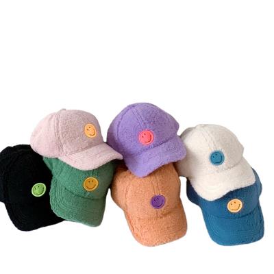 China COMMON Korean Embroidery Smiley Hat Kids Berber Fleece Baseball Hat Winter Boys And Girls Plush Warm Peaked Hat In Stock for sale