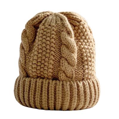 China ZG COMMON Twist Warm Knitted Hat For Women Winter Curving Earflaps Ladies Hat Solid Beanie Hats Fashion for sale