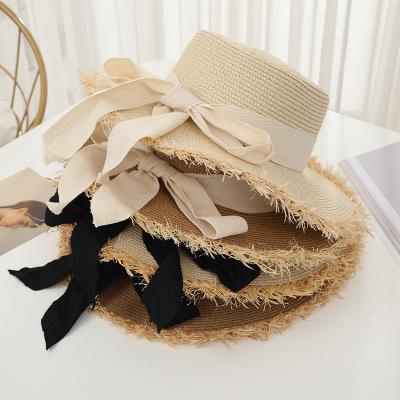 China Cool Design Popular Women's Summer Weave Straw Hat With Bow Girls Seaside Vacation Beach Hat Elegant Style In Stock 2023 for sale