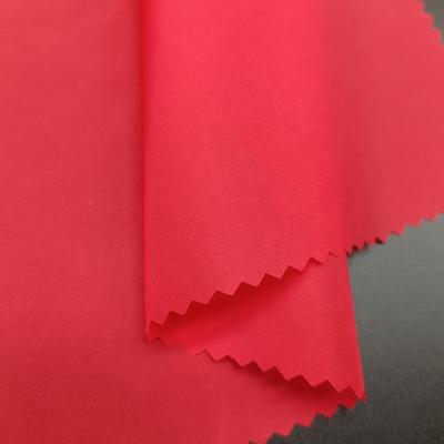 China QIHANG waterproof ready to ship waterproof 400T nylon trilobal taffeta fabric for down coat for sale