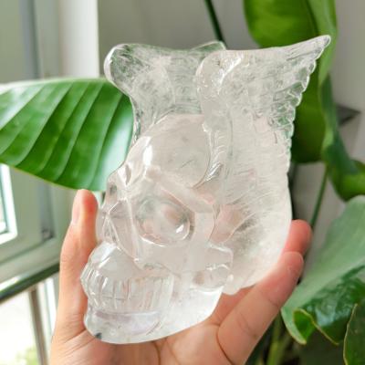 China China Wholesale Natural Gemstone Quartz Clear Skulls With Wings Crystal Skulls Crafts For Home Decoration for sale