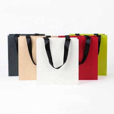 China Biodegradable Custom Paper Carrier Bag Handle Shopping Gift Bag With Your Own Logo for sale