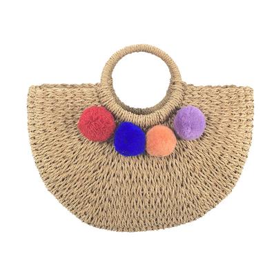 China Fashion 100% straw basket style straw handmade crochet paper bag with pom poms for sale