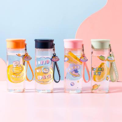 China Cute Kids Sustainable Hot-selling Plastic Water Bottle With Silicone Handle Enti-drop Kids Gift Students Sport Cartoon Bottle for sale