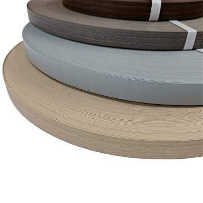 China Furniture Edge Protection Wood Melamine PVC Dark Edging Hot Grain Pregummed Tape for sale