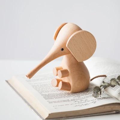 China Nordic wooden NASIDA opener wooden elephant wooden puppet nozzle design decoration export wooden toy gift ornaments for sale