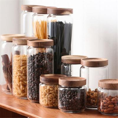 China Borosilicate Minimalist High Air Tight Glass Jar With Acacia Wood Lid for sale