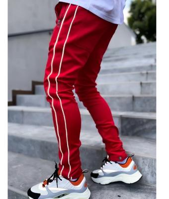 China Breathable Male Casual Pants Stripes Street Fashion Reflective Pants With Drawstring Slim Trousers For Men for sale