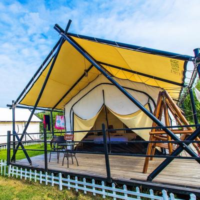 China Large Waterproof Outdoor Camping Use Hotel Resort Tents Waterproof Luxury Steel Canvas Pole Glamping African Safari Tent for sale