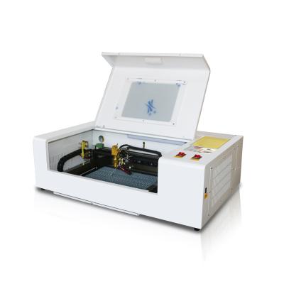 China Resure 40W 50W Fully-enclosed Laser Machine Engraving And Cutting Machine for sale