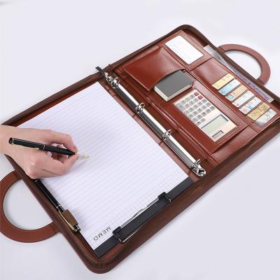 China Custom Logo A4 Business Leather Folder Planner With Ring Binder Calculator Notebook Premium Abstract Folder Leather Briefcase for sale