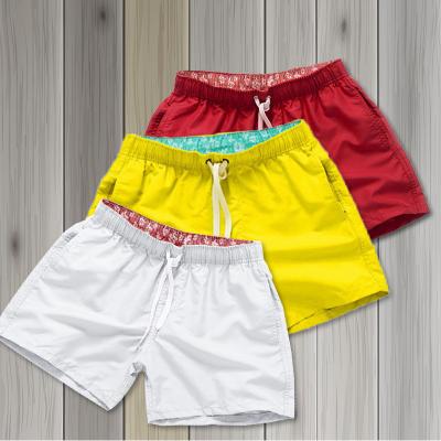 China Anti-Wrinkle Wholesale Cheap Price Men Beach Nylon Shorts Summer Solid Color Beachwear Custom Design Pocket Quick Dry Men's Swim Shorts for sale