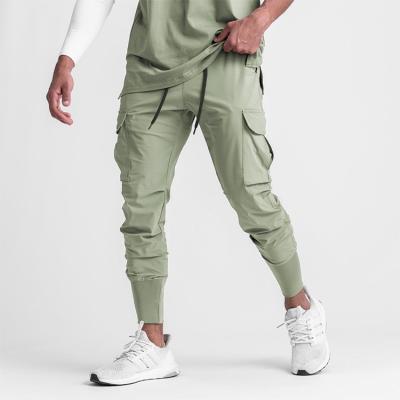 China Anti Wrinkle Anti Wrinkle Mens Amazon Pants Gym Sportswear Quick Dry Jogger Pants With Pockets Plus Size Mens Jogger Pants for sale