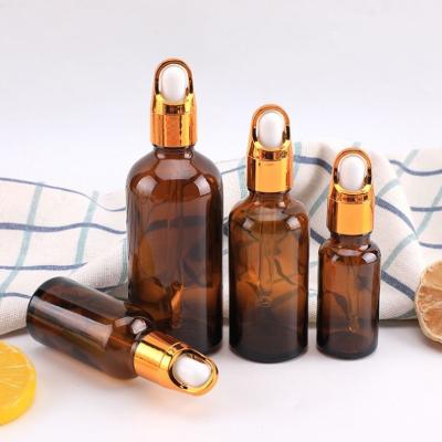 China Cosmetic Essential oil packaging 5ml 10ml 15ml 20ml 30ml 50ml 100ml clear green amber glass essential oil bottle with plastic dropper for sale