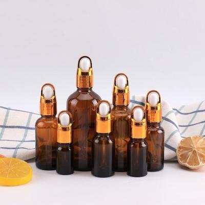 China Cosmetic wholesale full sizes 5ml--100ml amber glass bottles pipette dropper cap essence serum container for sale