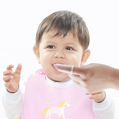 China 100%food grade silicone Teether 2021 new design baby teether box package silicone baby training finger toothbrush for sale