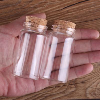 China Wholesale Match 5-100ML Clear Glass Jar Candle Storage Jar Glass Bottle Freshness Preservation With Cork Lid for sale