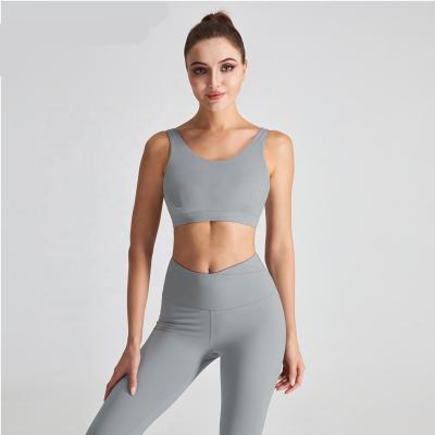 China Breathable Removable Padded Sports Bra Top Gym Nude Crop Fashion Shock Absorber Women Mask Strappy Sports Bra for sale