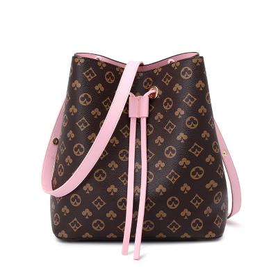 China New style bag drawstring bucket bag female fashion PU printing portable niche shoulder messenger bag for sale