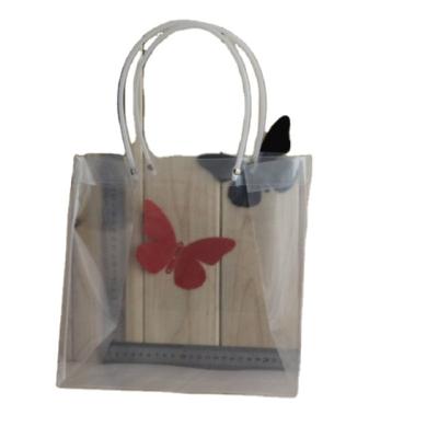 China Recycled Transparent Square Potted Materials Bag Flower Gift Box Pipe Handbag Plastic Bag for sale