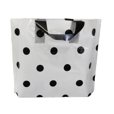 China Recycled Materials Women's Store Plastic Handbag Clothing Shopping Bag Plastic Dress Bag for sale