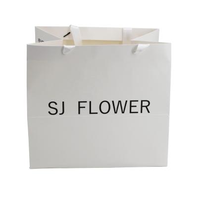 China Recyclable Custom Logo Flower Clothes Shoe Packaging Merchandise Bag for sale