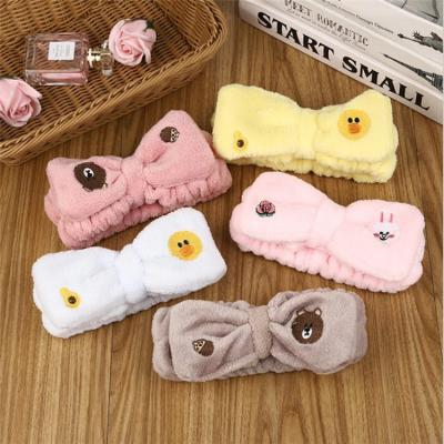 China New Korean popular cartoon fluffy bow cute bear hair band wash face yoga hair band for sale