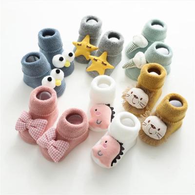 China New autumn and winter wool ring breathable thick baby bumps cartoon doll point glue non-slip floor socks for sale