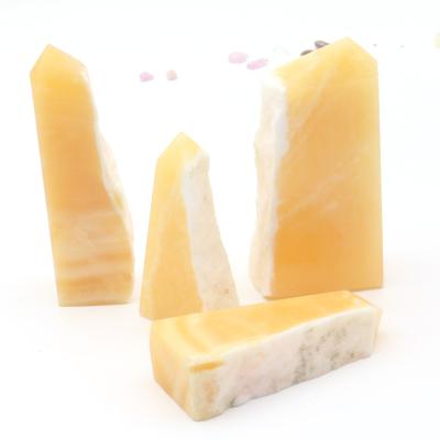 China 2021 New China Crystals Healing Stones Natural Orange Yellow Calcite Trick Stone Wand Point for sale