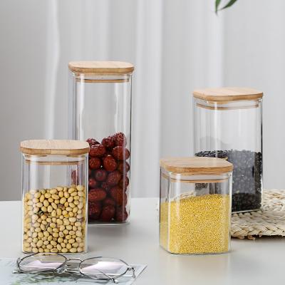 China Freshness Keeping Kitchen Sealed Glass Jar Airtight Square Storage Tub Spices Reservoir Tea Container With Lid Salt Storage Bottle Bamboo Coffee Cart for sale