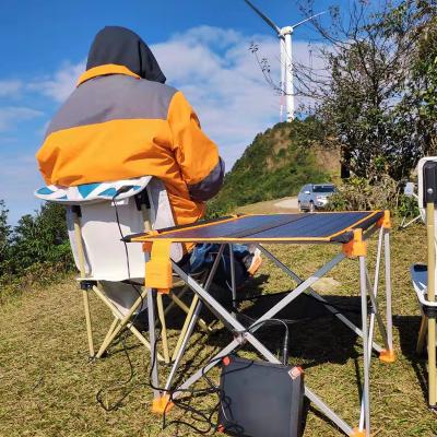 China Modern New Innovative 2022 Outdoor 30w Table With Solar Panel Folding Table Portable Aluminum Camping Table for sale