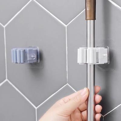 China Adhesive Wall Mounted Mop Holder Tool Organizer Broom Hanger Broom Grip Hook Storage Modern Household Sticker for sale