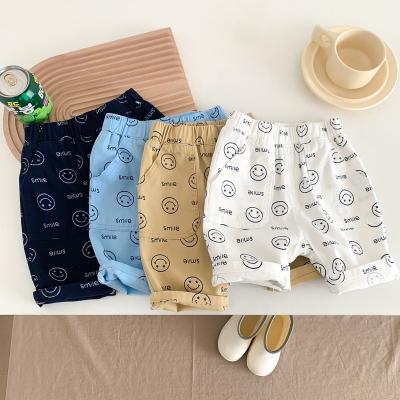 China Anti-pilling slim side pockets smile toddler clothes summer shorts casual style smiling kids bottom pants for sale