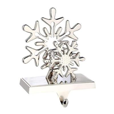 China Popular Xmas Gift Metal Double Cast Snowflake Casting Stocking Rack For Christmas Decoration Mantle for sale