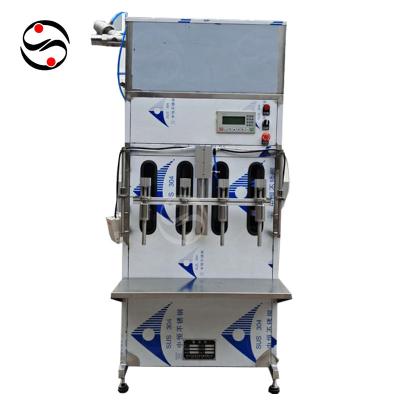 China High efficiency factory dicret filling machine price vertical gravity edible oil filling machine for sale