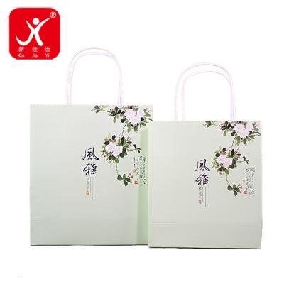 China Xin Jia Yi Packaging Luxury Party Recyclable Paper Bags Occasion Recyclable Kraft Paper Tea Paper Bag Gift China Style Shopping Bag Factory Sales for sale