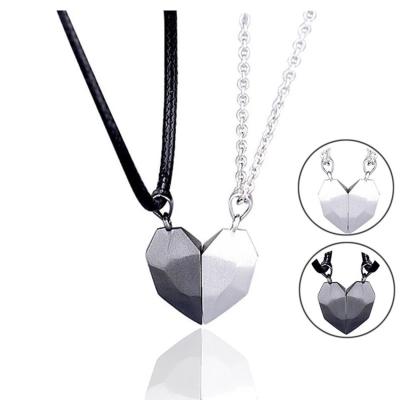 China Fashionable punk amazon couples necklace magnetic heart stones clavicle splice matual attraction between lovers pendant for sale