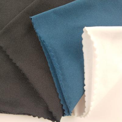 China Antistatic 220gsm 4 Way Stretch Polyester Spandex Knitted Plain Jersey Fabric With Brushed Te koop