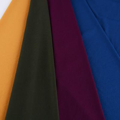 China High Quality Anti-Static Plain Dyed 100% Polyester Twist Coupling For Shirts Tops Uniform Blouse en venta