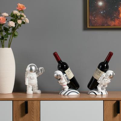 China Outdoor Europe Christmas Other Party Decorations OEM ODM Astronaut Decoration Wine Rack Arts Resin Crafts Sculpture for sale