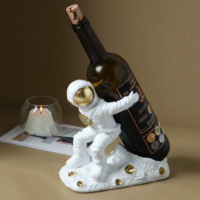 China Europe Latest Design Home Decoration Spacemansculpture Wine Rack Decoration Arts and Crafts Resin for sale