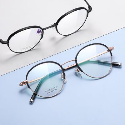 China Reading Books Factory New Pure Titanium Glasses Frame Retro Frame Female Round Flat Mirror High End Glass Frame Female for sale