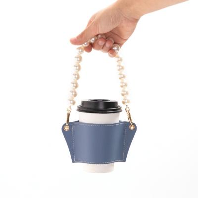 China Viable Fancy PU Heat Insulation Bottle Coffee Leather Takeaway Cup Holder With Bead Chain for sale