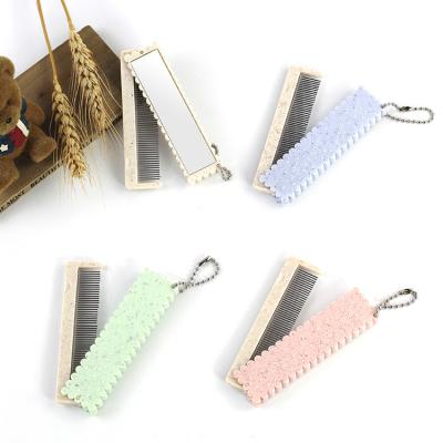 China Simple Design Comfortable Portable Stainless Steel Folding Comb With Mirror for sale