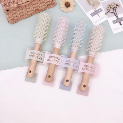 China Eco-Friendly Round Shape Wheat Straw Nylon Bristle Wood Handle Hair Brush for sale